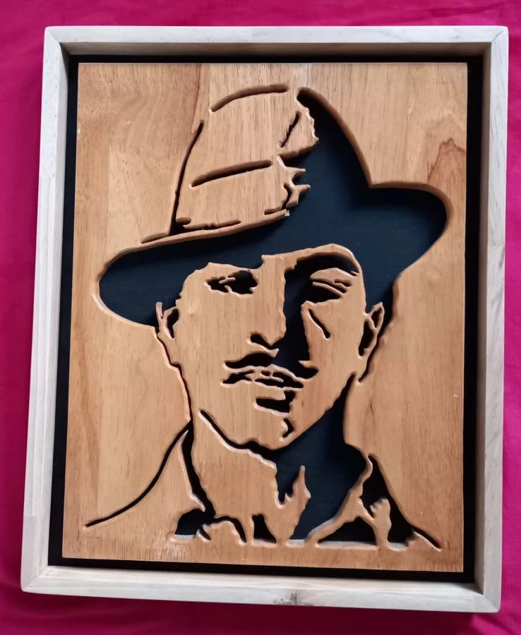 Bhagat Singh portrait in his signature hat, hand-cut in wood