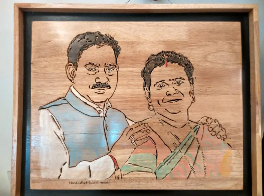 Hand-painted couple portrait in a wooden frame
