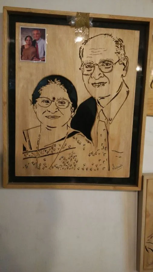Portrait of a couple with the reference photograph pinned alongside
