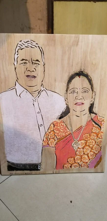 Hand-coloured couple portrait cut in solid wood