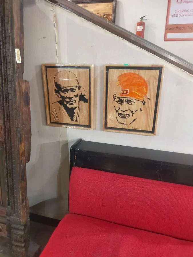 Two Sai Baba panels hung together on a display wall