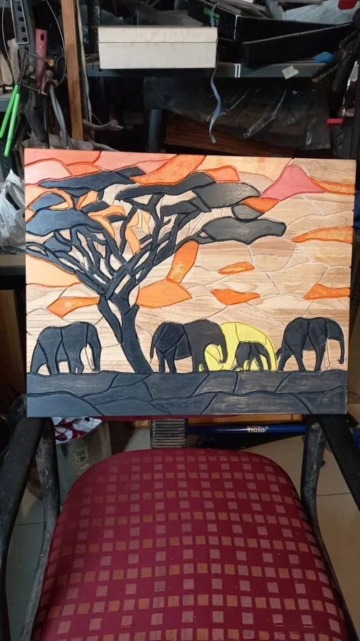 Hand-painted panel of elephants crossing a landscape