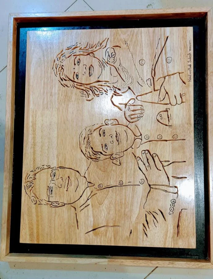 Family group portrait in progress on a wood panel