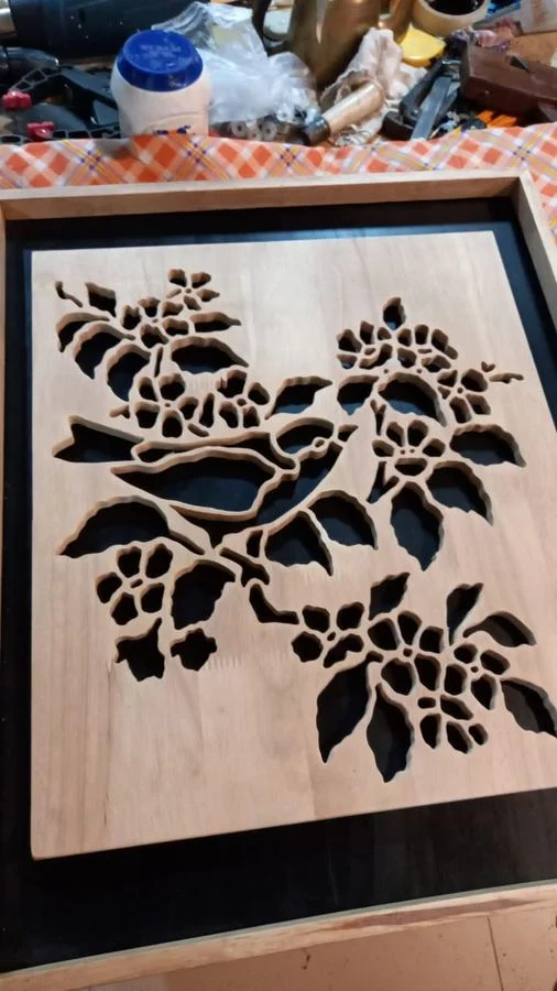 Leaves and blossom cut as an open fretwork panel