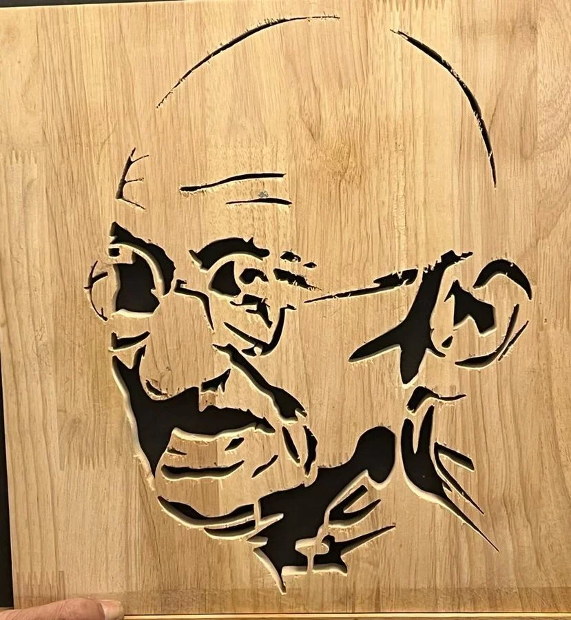 Large Gandhi panel held up to show the hand-cut fretwork