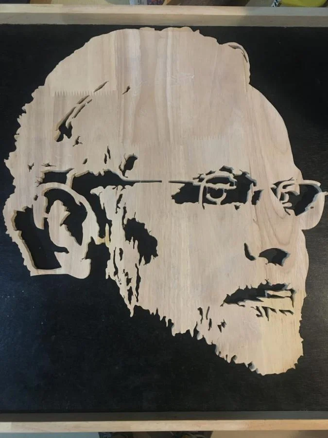 Narendra Modi silhouette cut-out photographed against a black surface