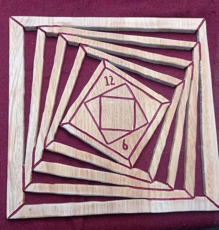 Geometric spiral panel cut in wood