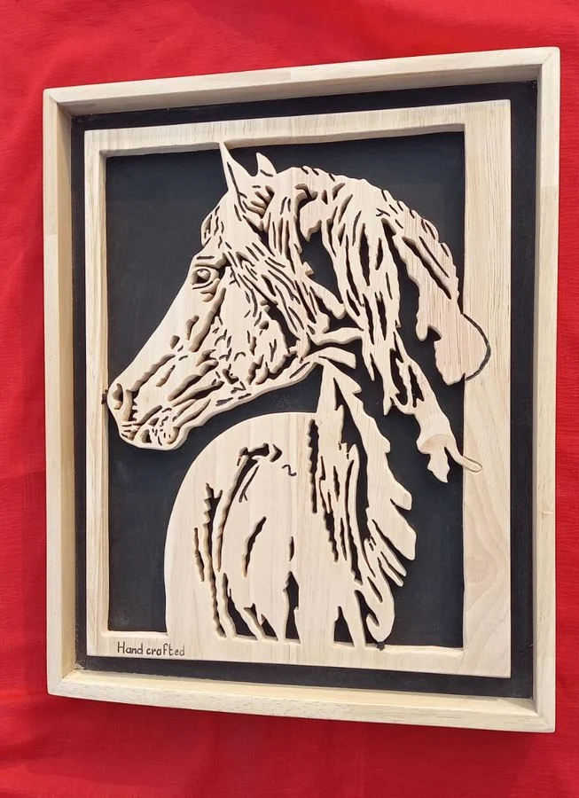 Horse with a flowing mane cut in solid wood