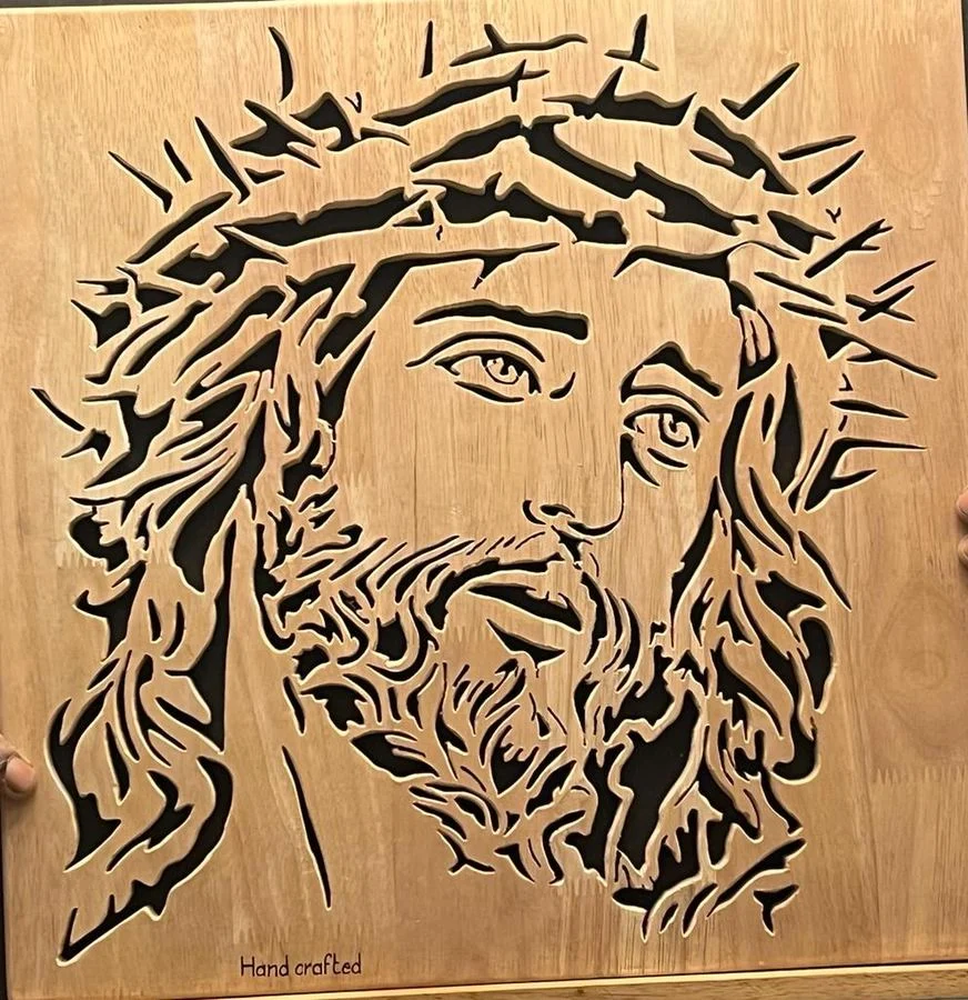 Christ crowned with thorns, an intricate scroll saw panel marked Handcrafted