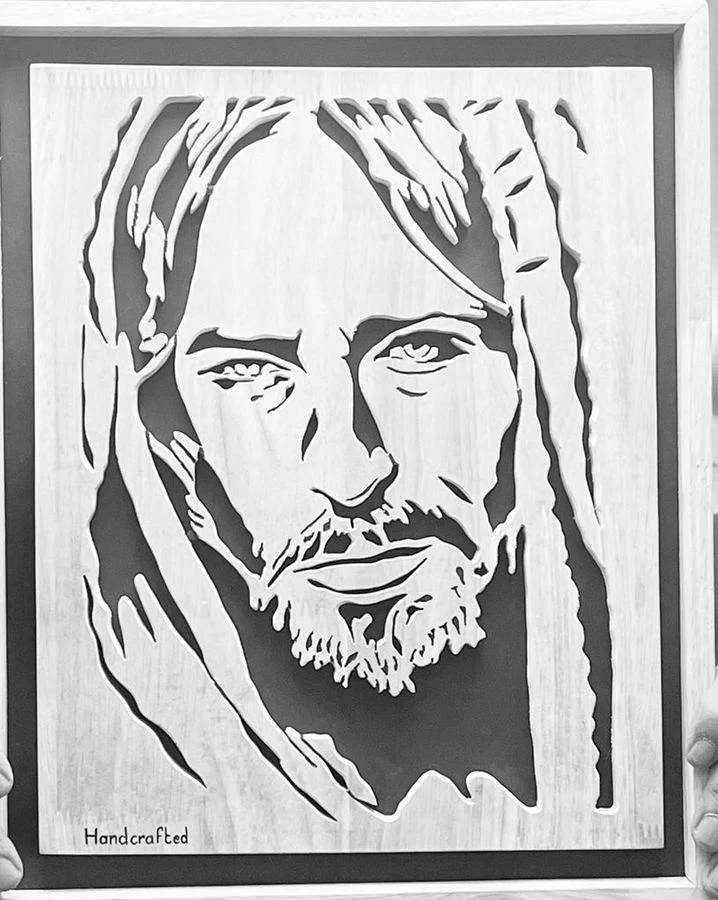 Portrait of Christ in a pale finish with a silver frame
