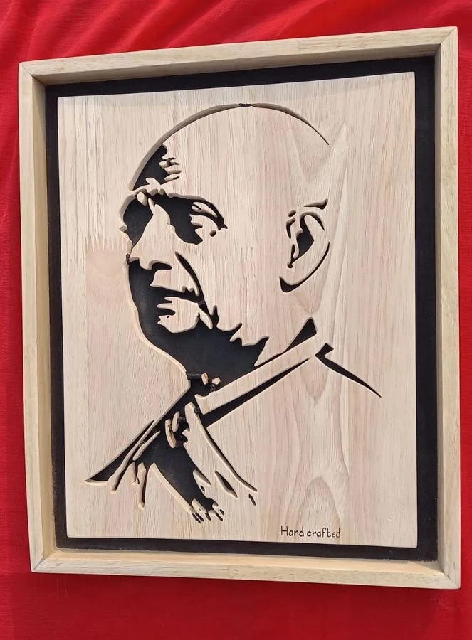 Portrait of an Indian statesman hand-cut in wood and framed