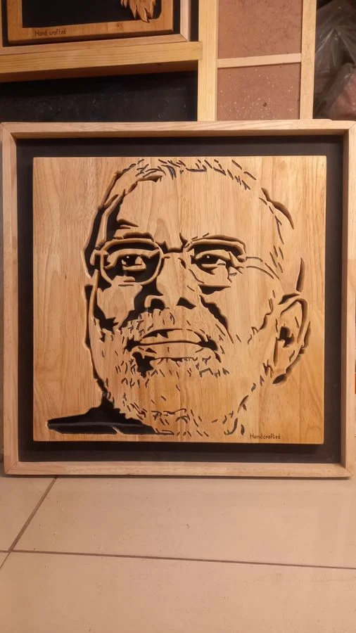 Wood portrait in a double frame, photographed on a tiled floor
