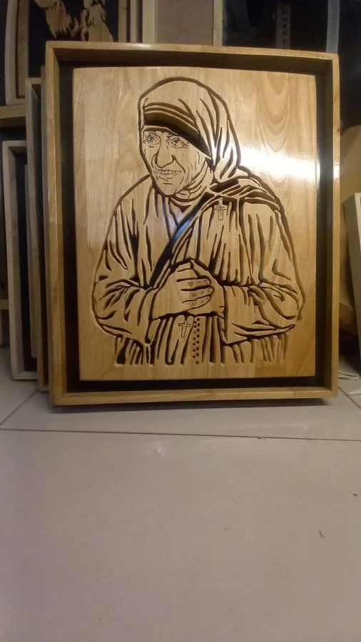 Framed Mother Teresa portrait in scroll-sawn wood