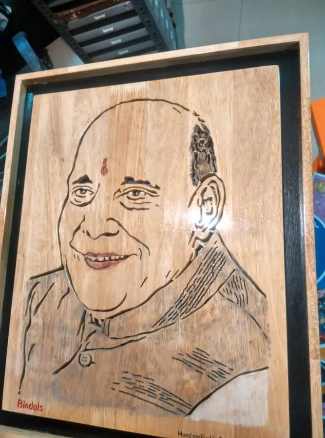 Hand-coloured portrait of a man in a wooden frame