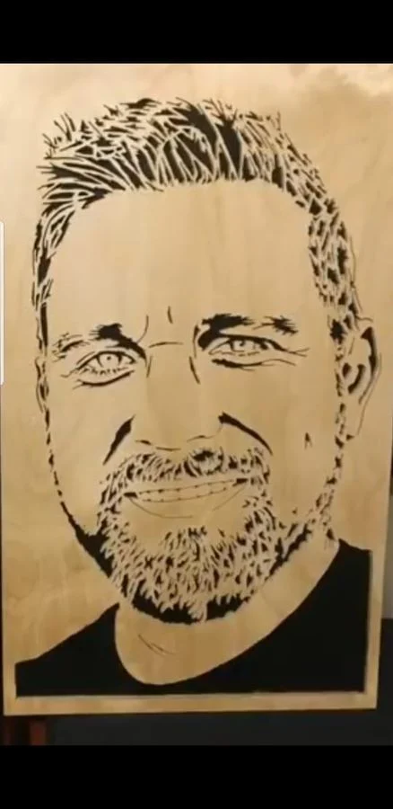 Portrait of a bearded man cut in solid wood