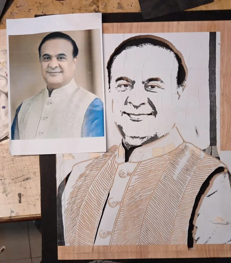 Portrait in progress with the reference photograph alongside