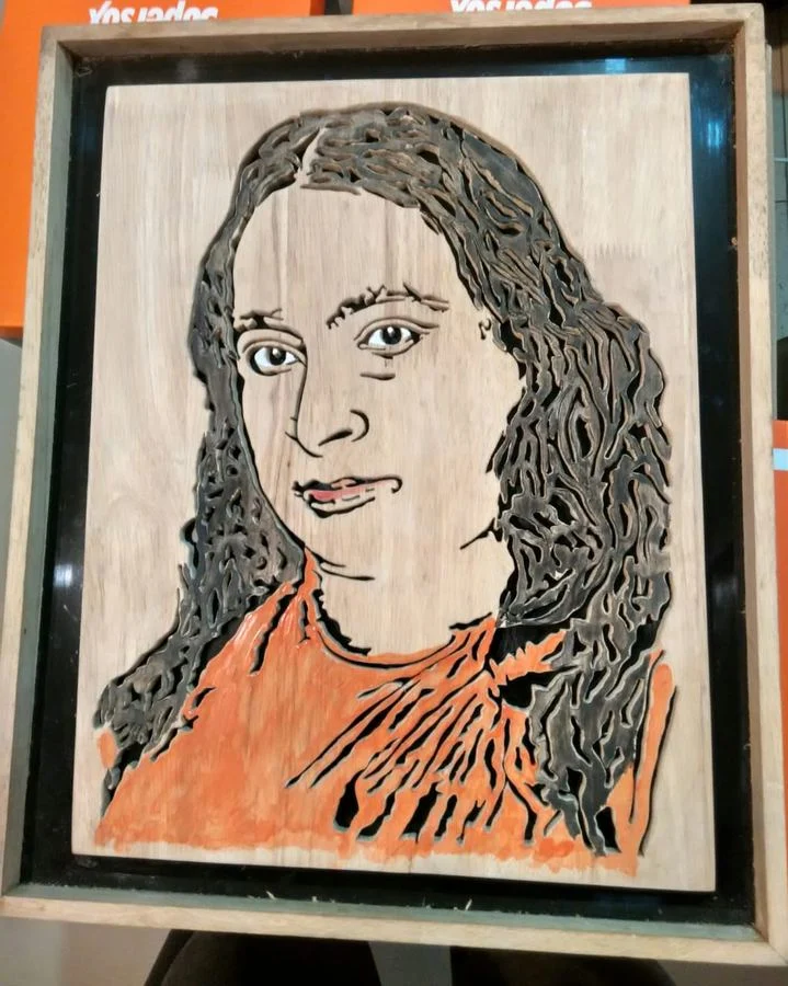 Hand-coloured portrait of a woman in a wooden frame