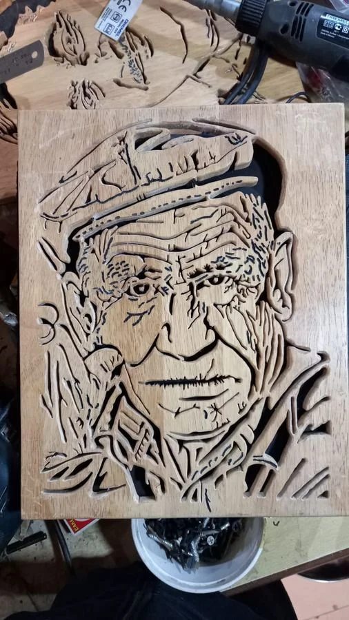 A freshly cut portrait panel resting on the workbench