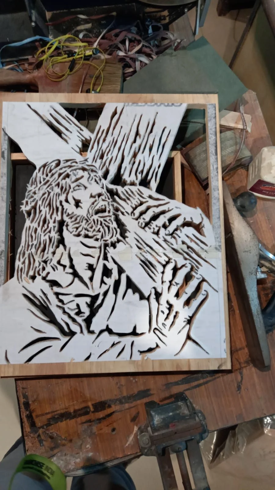 A panel on the scroll saw, black poster colour still marking the waste to be removed