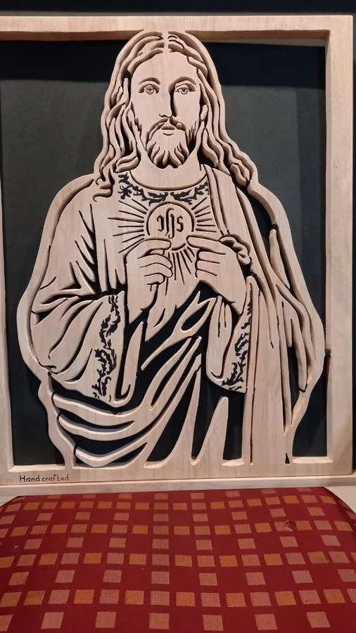 Large Sacred Heart panel standing on a patterned floor
