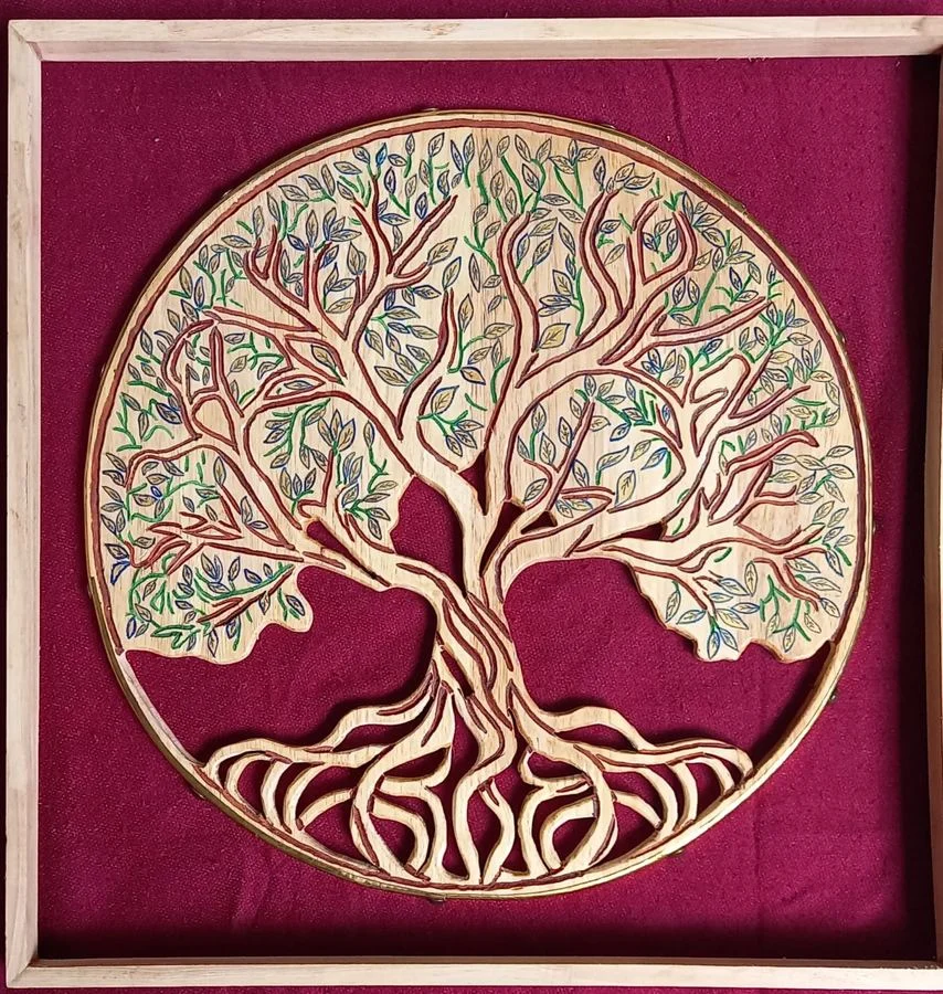 Tree of Life, hand-cut and painted, framed on a deep red ground