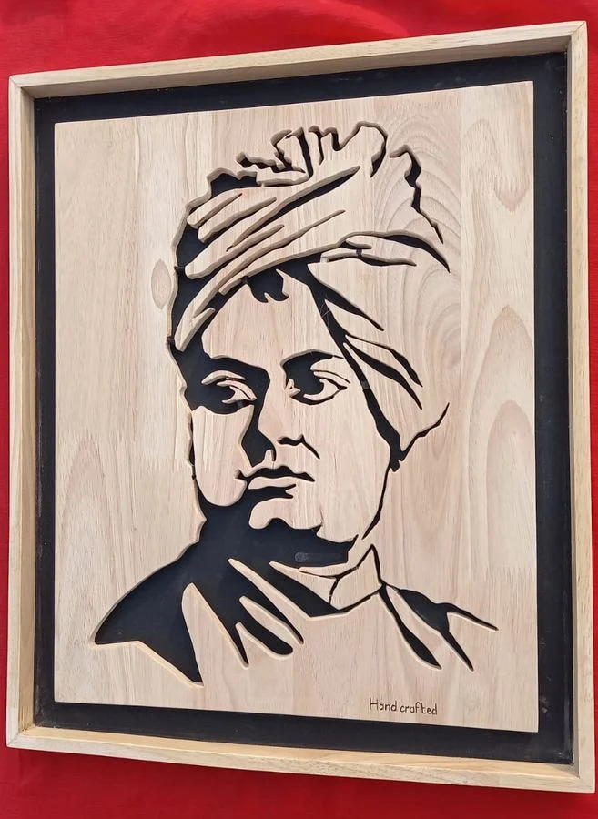 Swami Vivekananda portrait in a pale wood frame